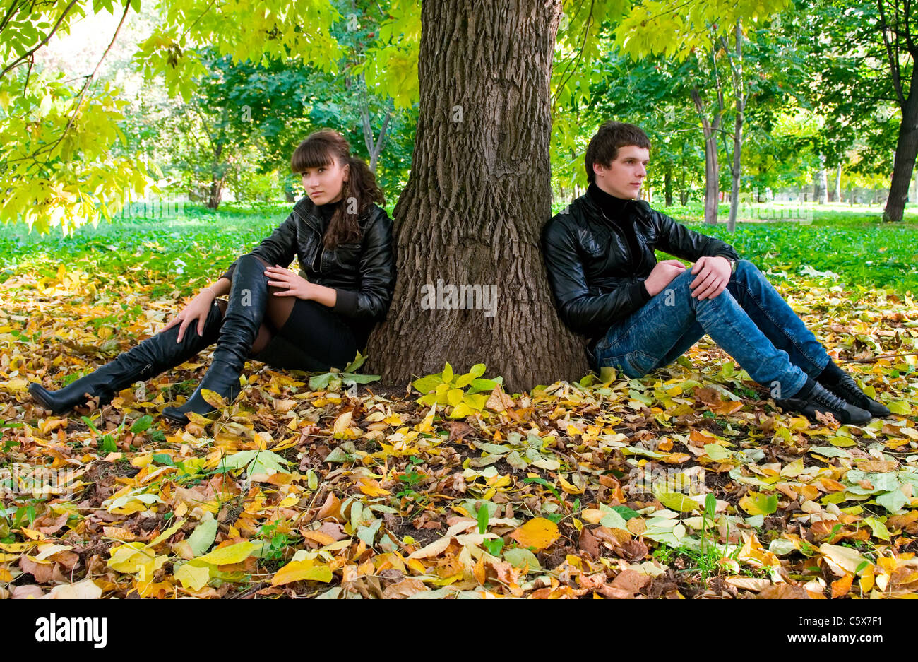 A young couple on a walk in autumn park Stock Photo - Alamy