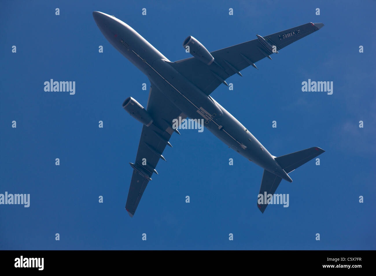 Military aircraft flying overhead Stock Photo