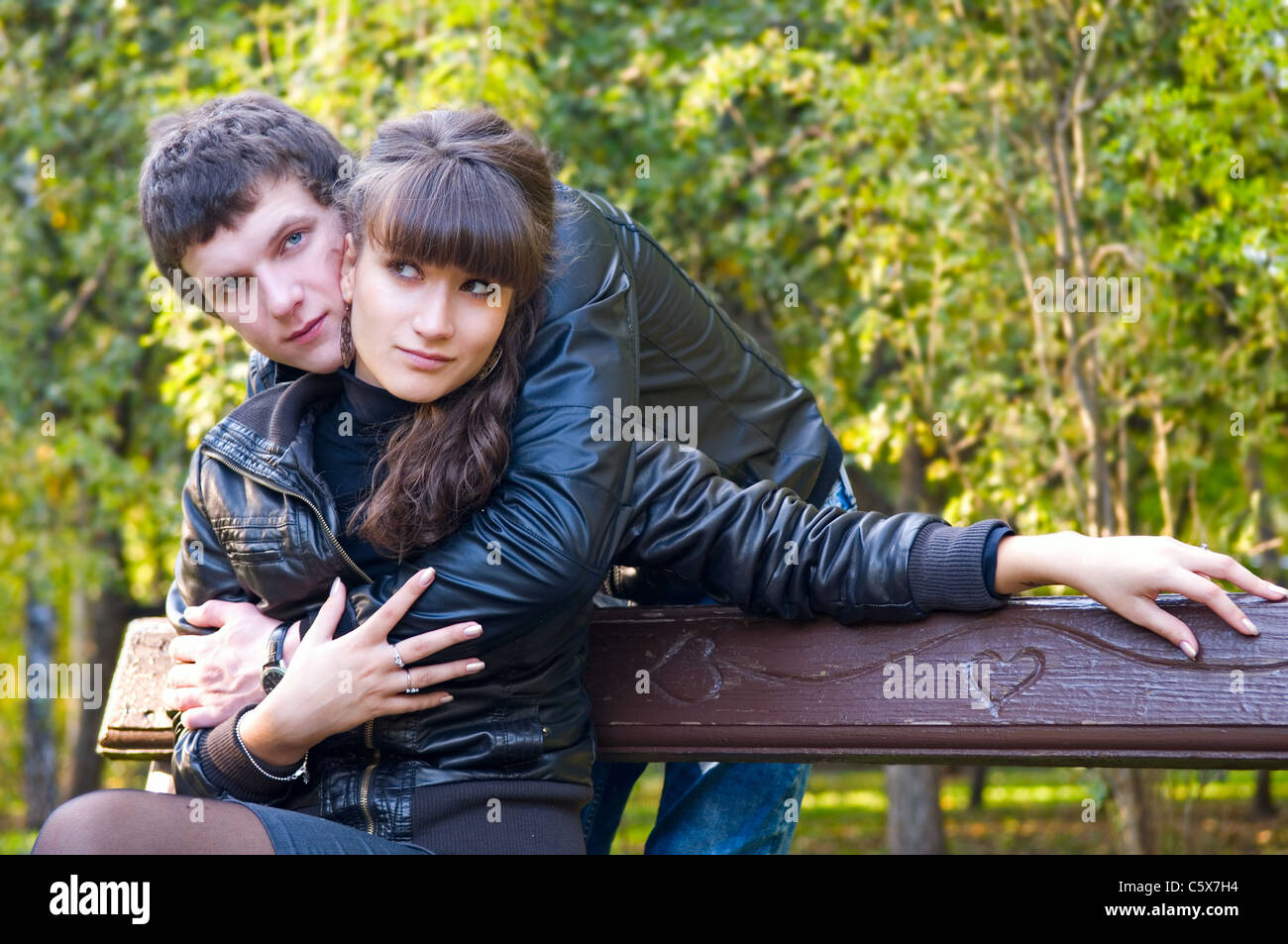 A young couple on a walk in autumn park Stock Photo - Alamy