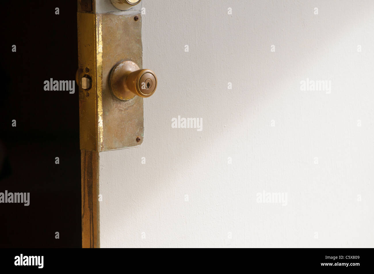 Open, unlocked door Stock Photo Alamy