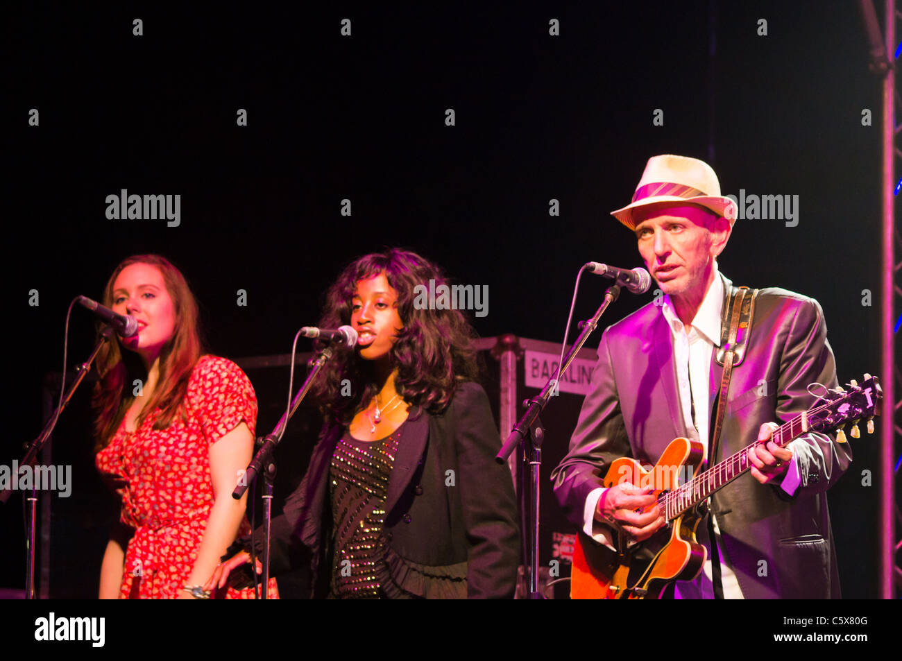 Jools Holland band member Mark Flanagan and singers performing at the