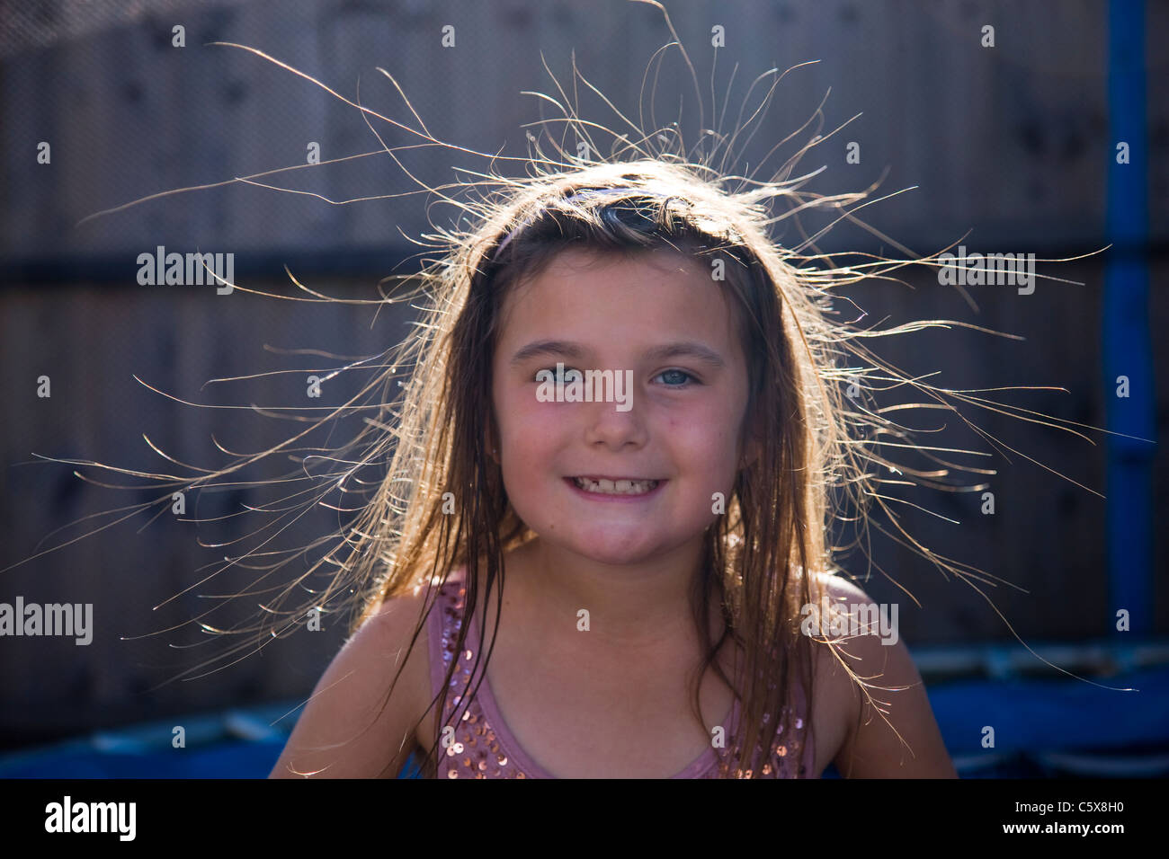 Little Girl Whose Hair Has Been Made To Stand Up On End By Static