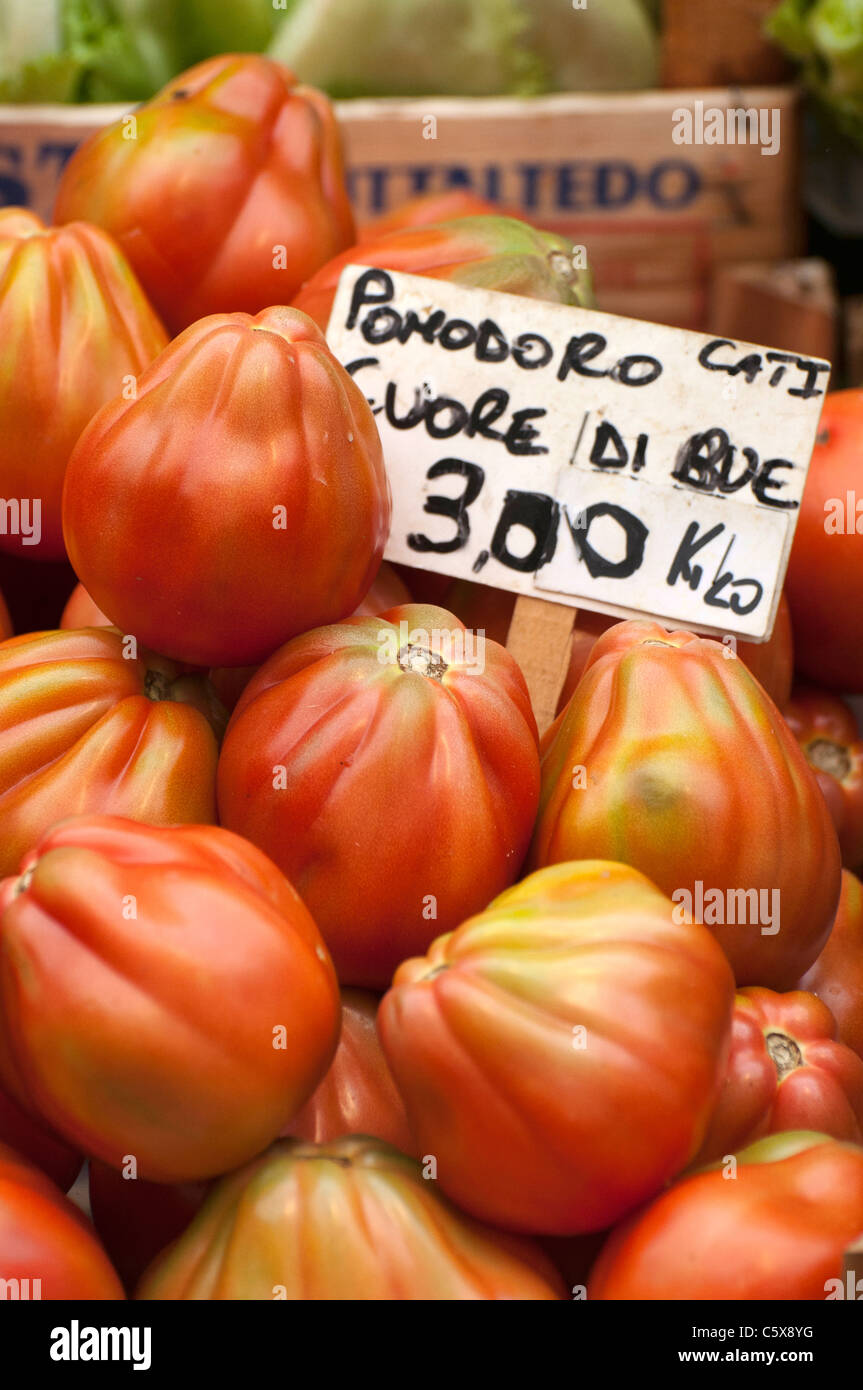 Display of big tomatoes 'Cuore di bue' at the outdoor market of Bolzano, Italy Stock Photo