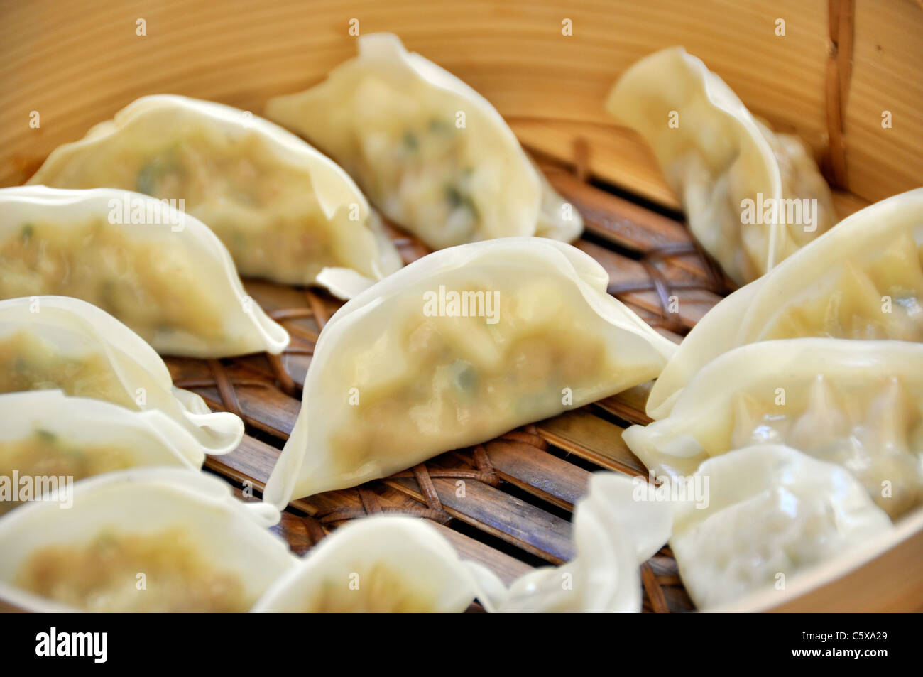 Dumplings in a bamboo steamer Stock Photo Alamy