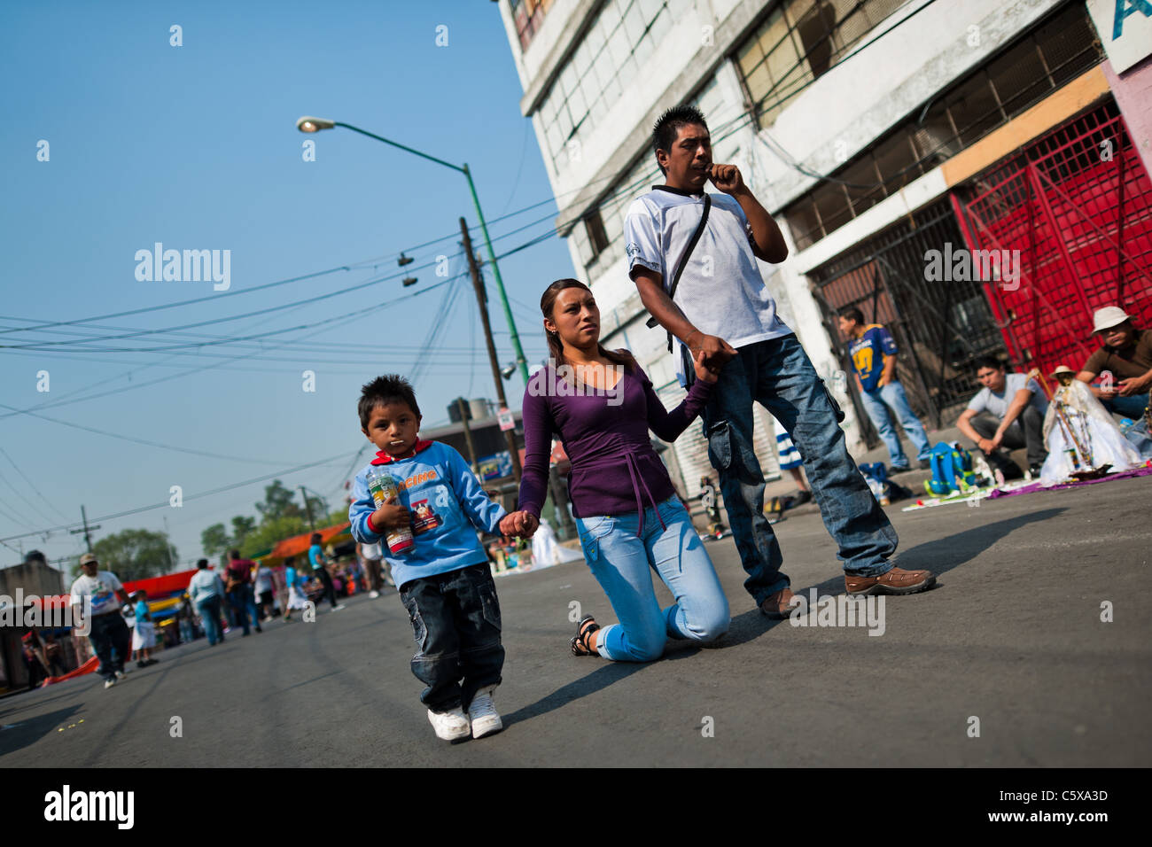 A Mexican follower of Santa Muerte (Holy Death) smokes a marijuana  cigarette during a pilgrimage in Tepito, Mexico City, Mexico Stock Photo -  Alamy