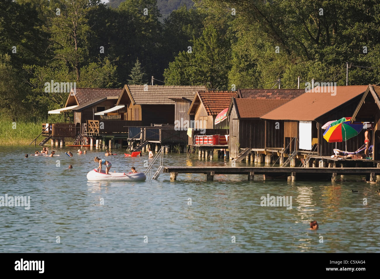 Austria, Salzkammergut, Zell am Moos, People swimming Stock Photo
