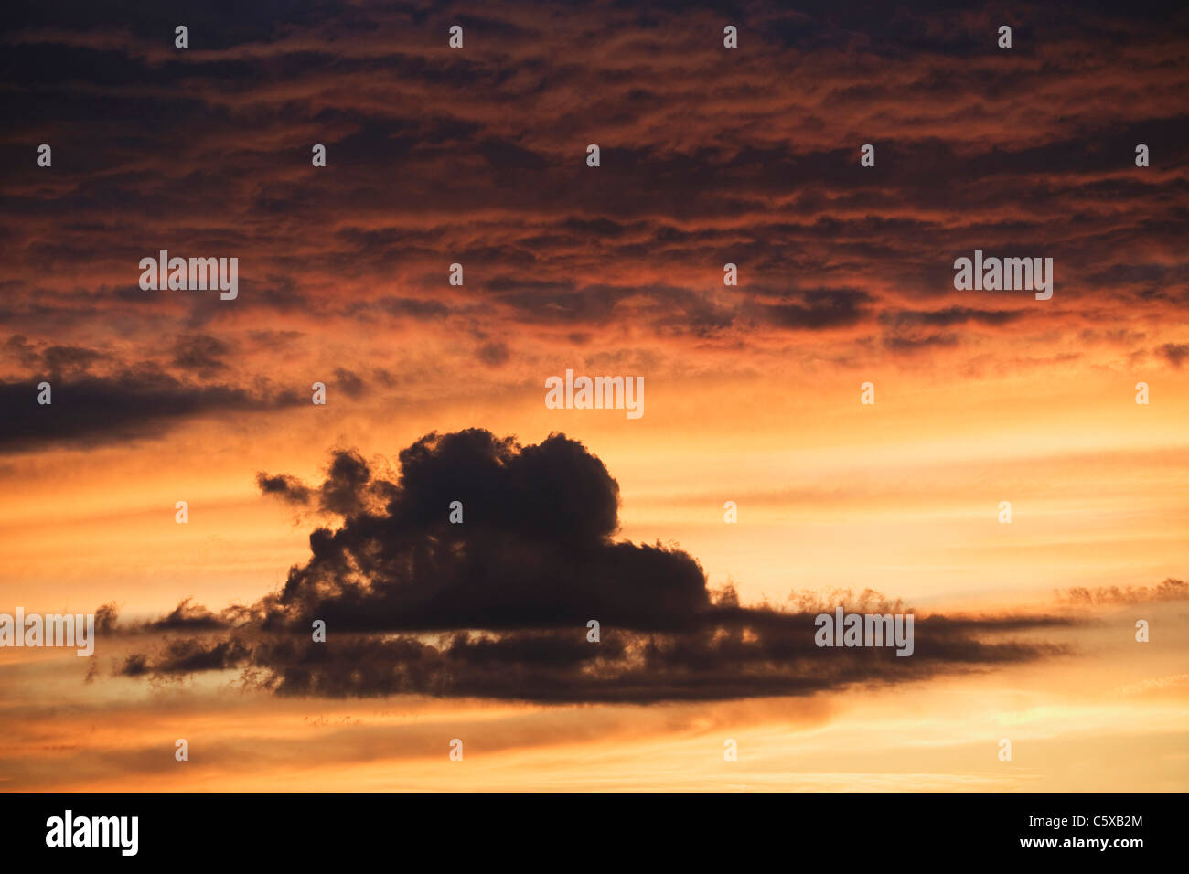 Austria, Cloudy sky with afterglow Stock Photo