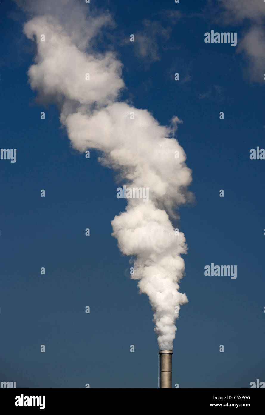 Chimney stalk polluting the air Stock Photo