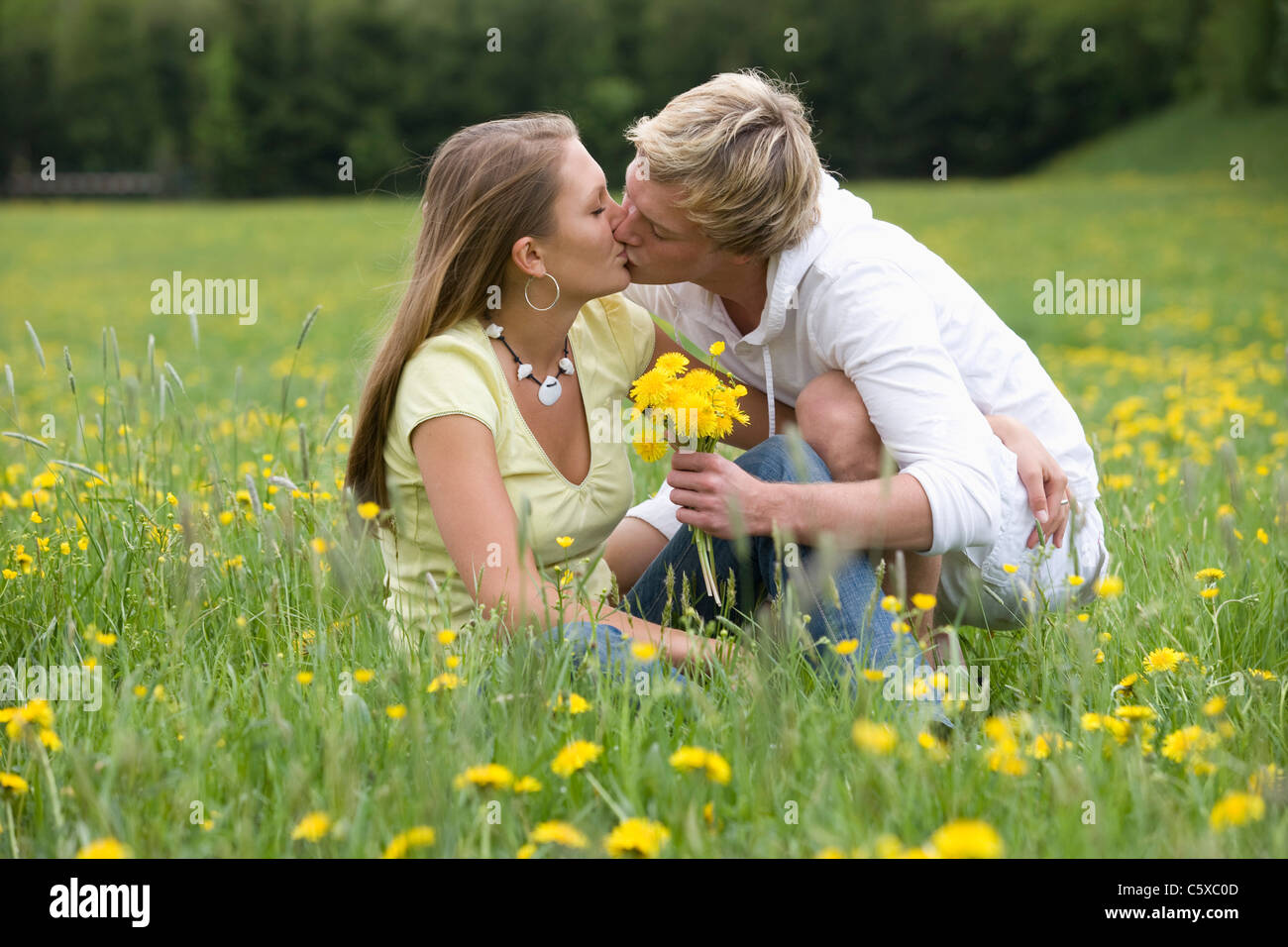 Austria Young Couple Kissing In Meadow Eyes Closed Portrait Stock Photo Alamy