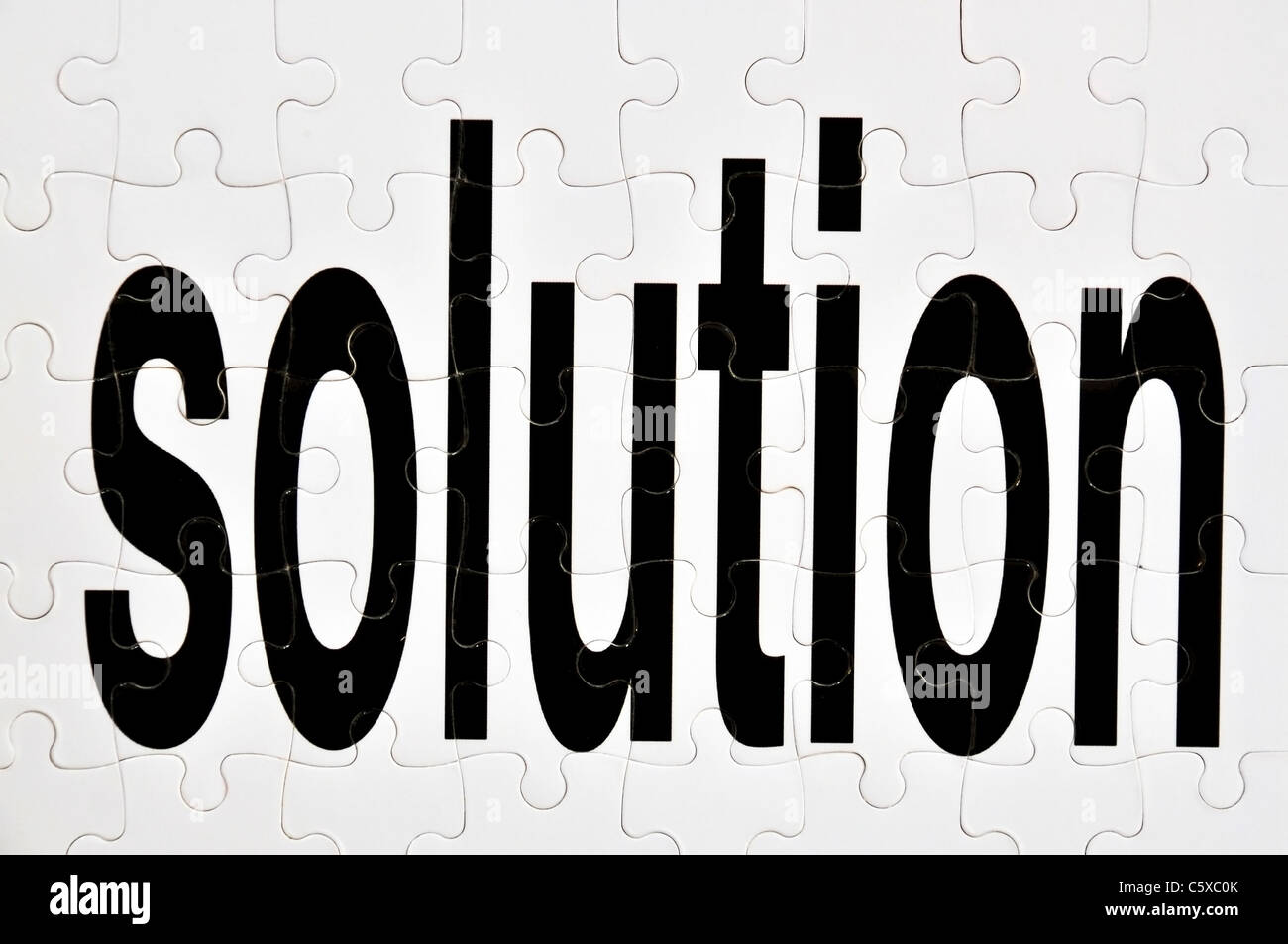 Conceptual image depicting the word solution as a jigsaw puzzle Stock Photo