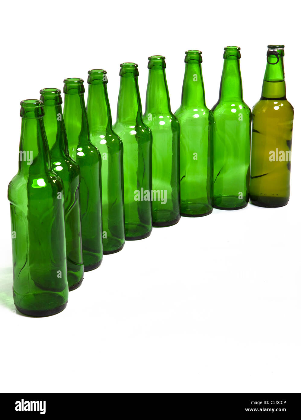 Empty glass bottles and one full in end of number Stock Photo Alamy