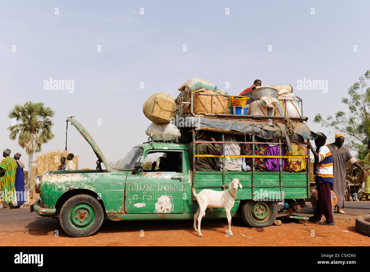 Africa MALI Mopti, people in old Peugeot car which works as a public transport in villages Stock Photo