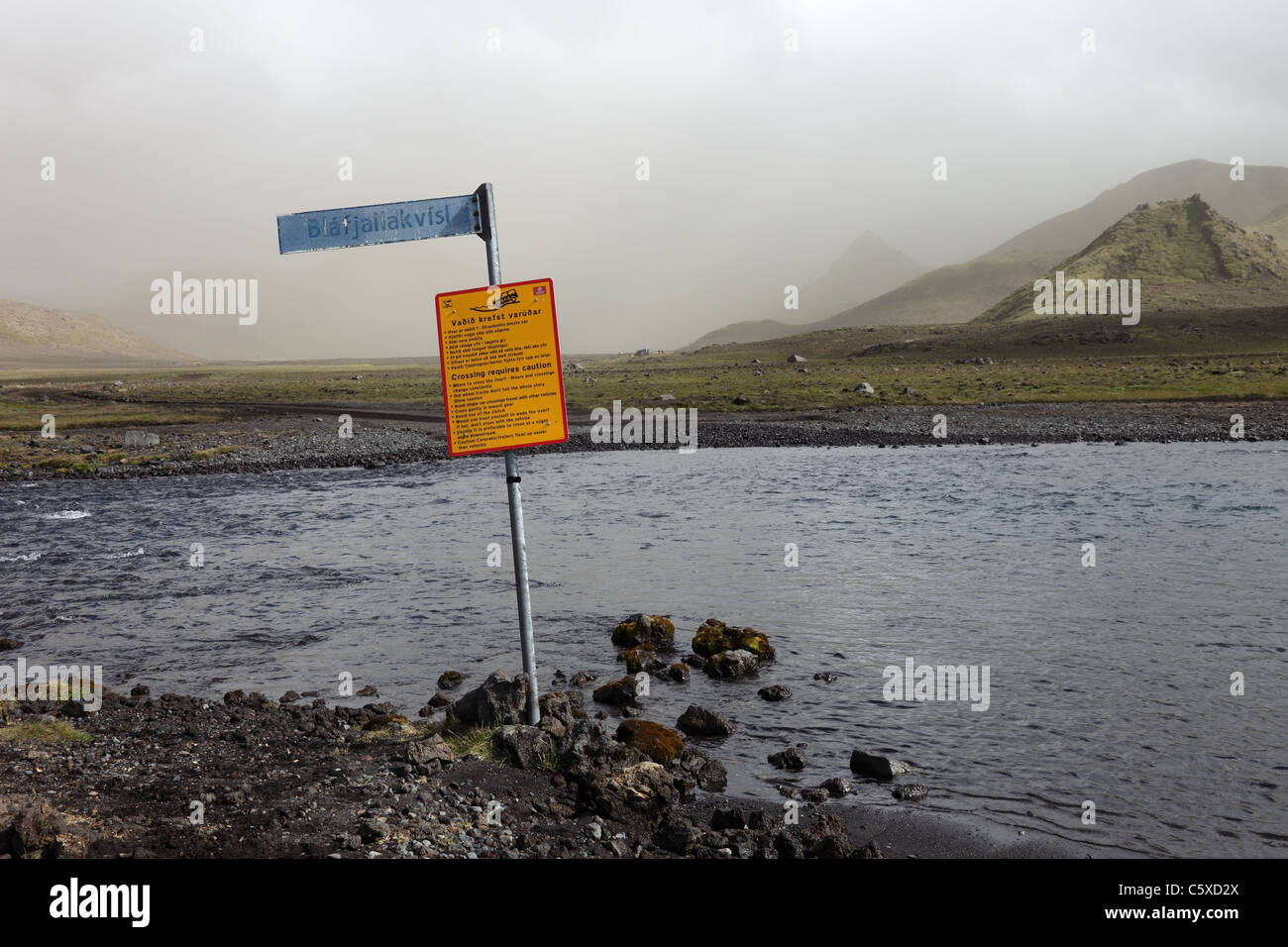 Warning Sign at the Crossing Point at the Blafjallakvisl River on the Laugavegur (Laugavegurinn) Hiking Trail, Iceland Stock Photo