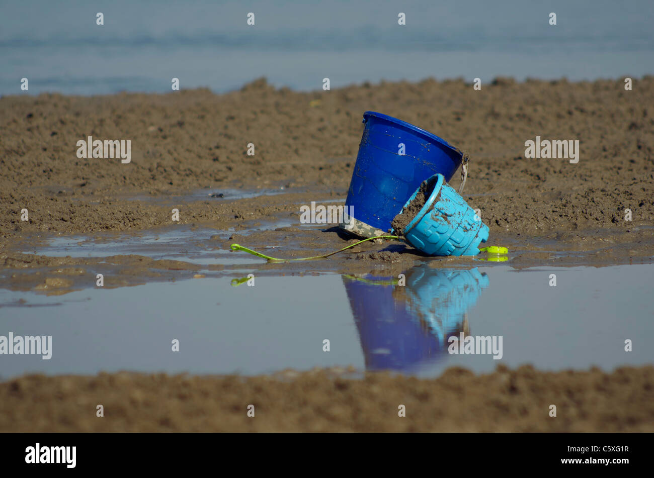 Two blue buckets on the beach Stock Photo Alamy