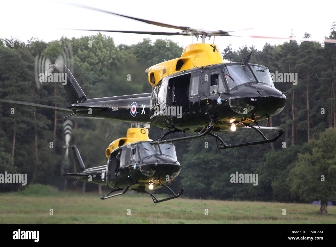 Cholmondeley Castle Pageant of Power. Bell 412 helicopters landing during a military assault demonstration. Stock Photo