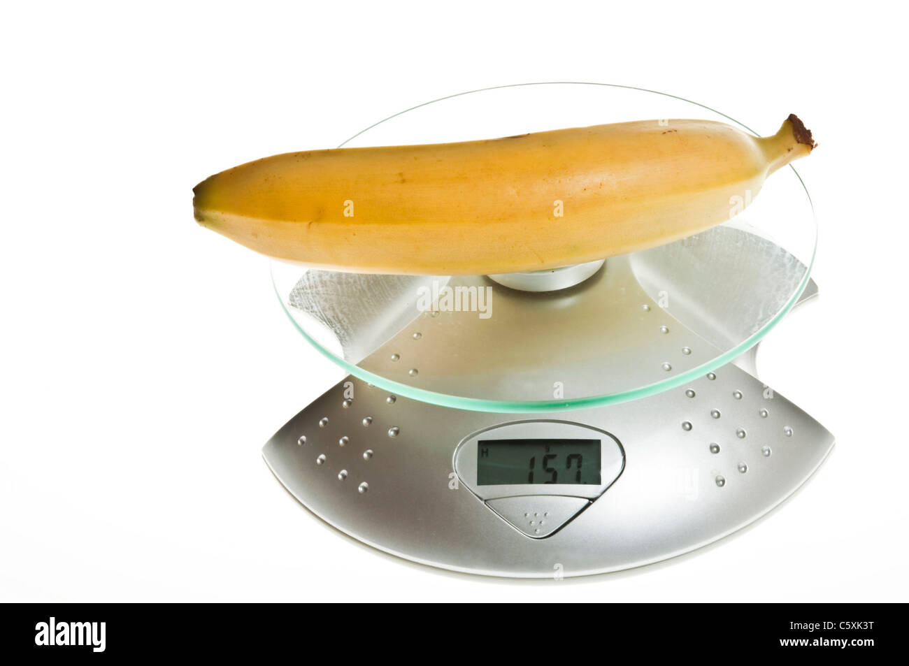 Banana isolated on food scale Stock Photo Alamy