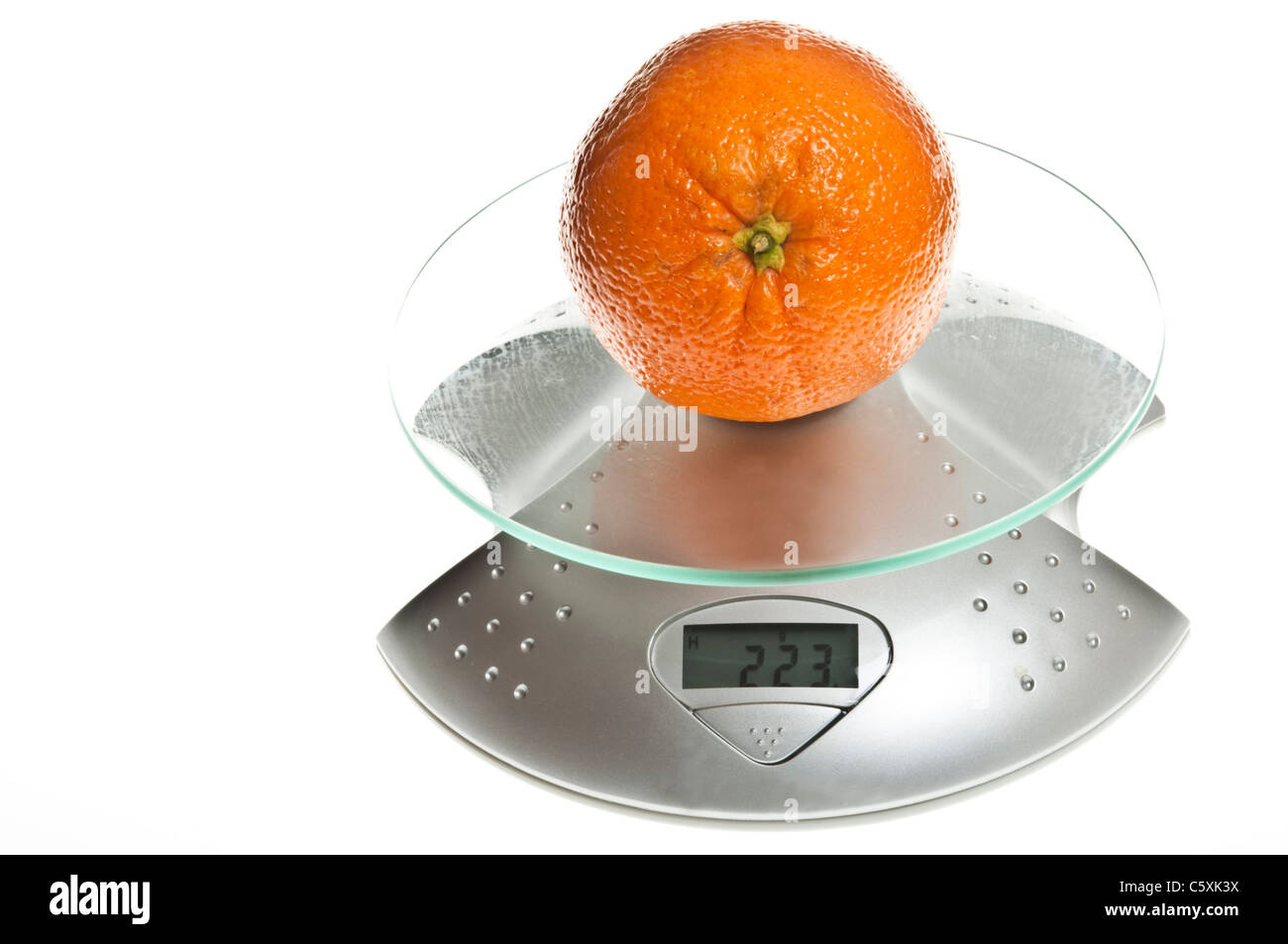 Orange fruit isolated on food scale Stock Photo Alamy