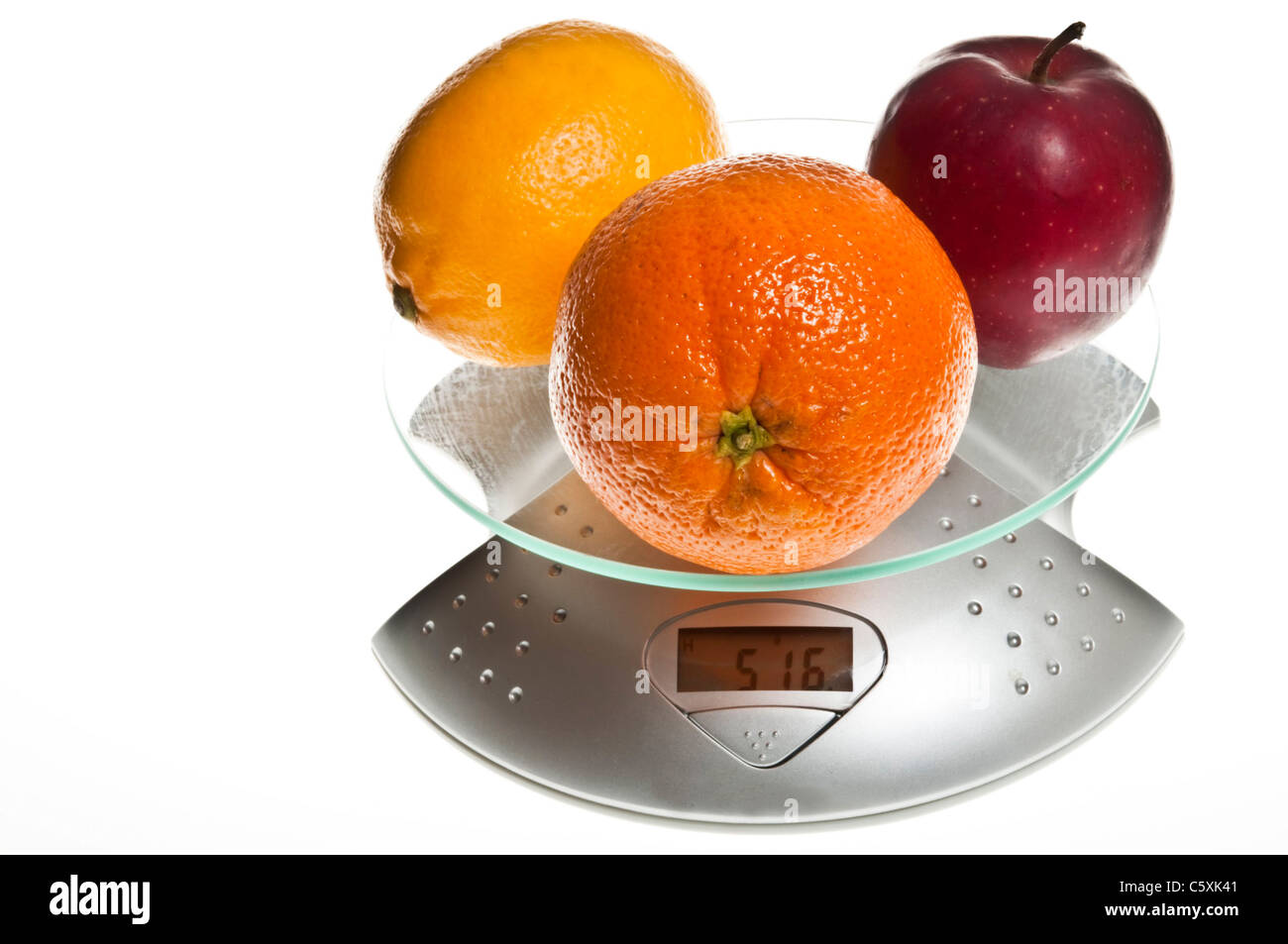 Mix of fruits isolated on food scale Stock Photo Alamy