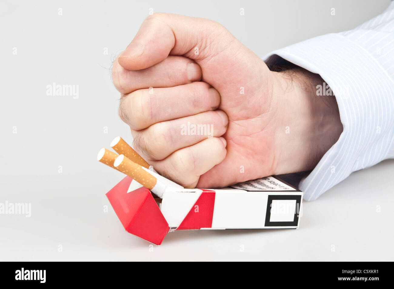 Man punch in cigarettes pocket Stock Photo Alamy