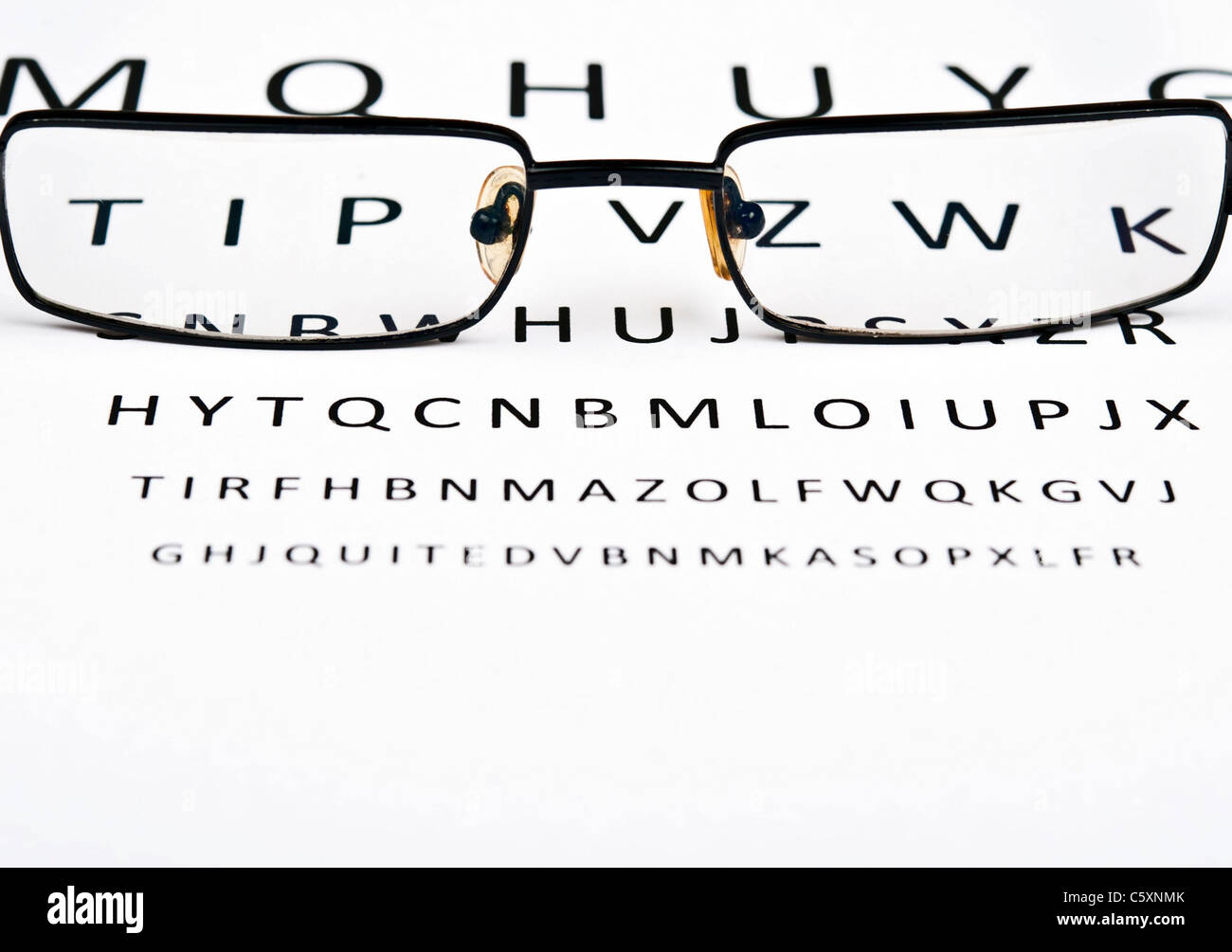 Eye glasses on examination paper Stock Photo Alamy