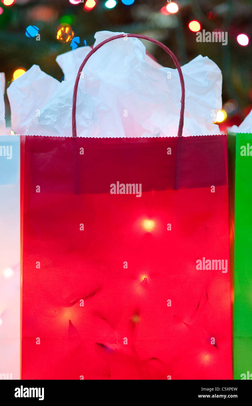 Colorful Christmas bags filled with Christmas Lights Stock Photo