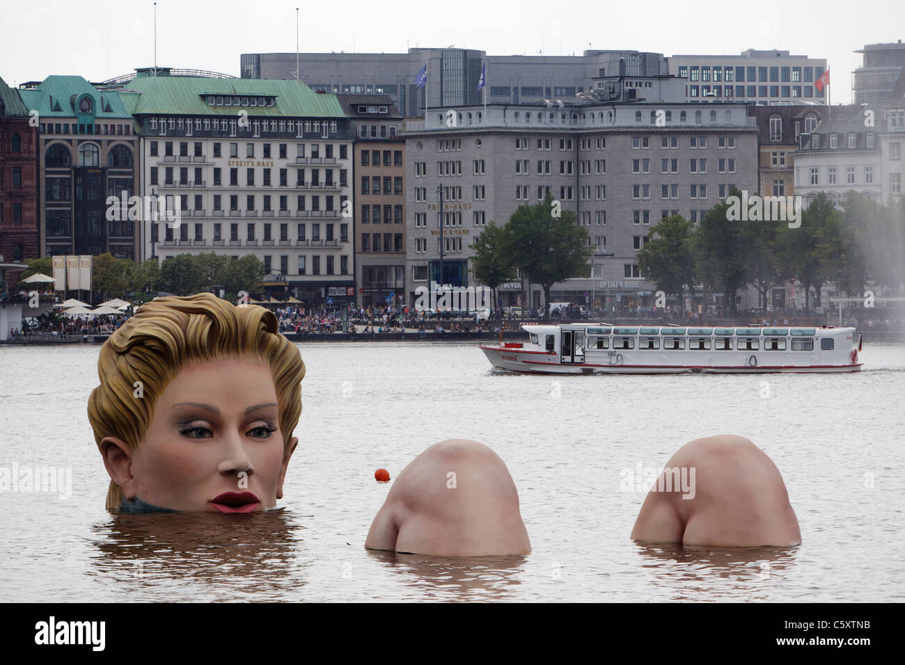 A 'mermaid' sculpture created by Oliver Voss is seen on Alster lake. Stock Photo