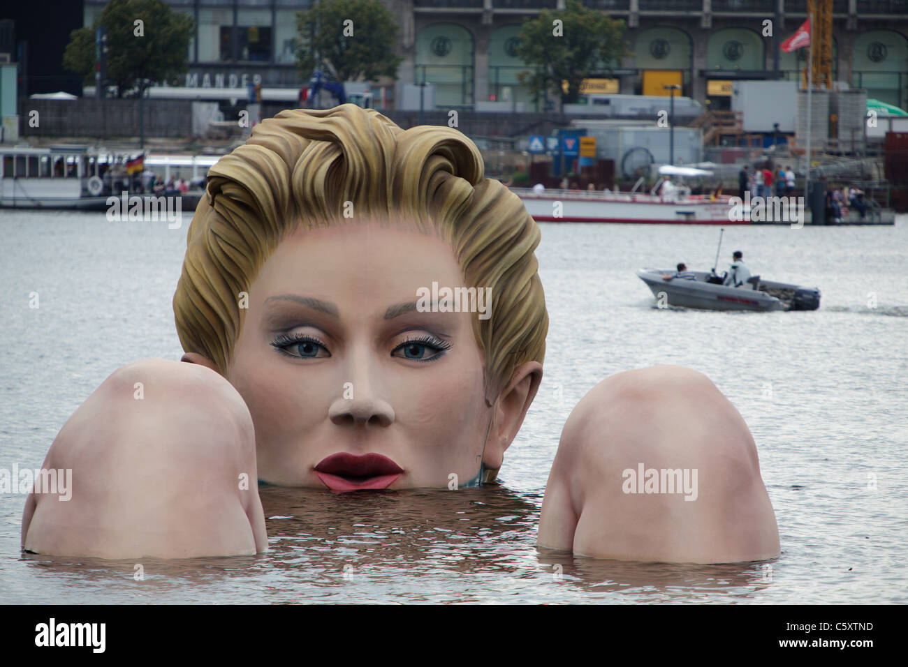 A 'mermaid' sculpture created by Oliver Voss is seen on Alster lake. Stock Photo