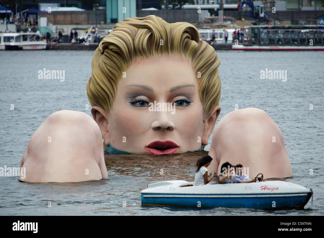 A 'mermaid' sculpture created by Oliver Voss is seen on Alster lake. Stock Photo