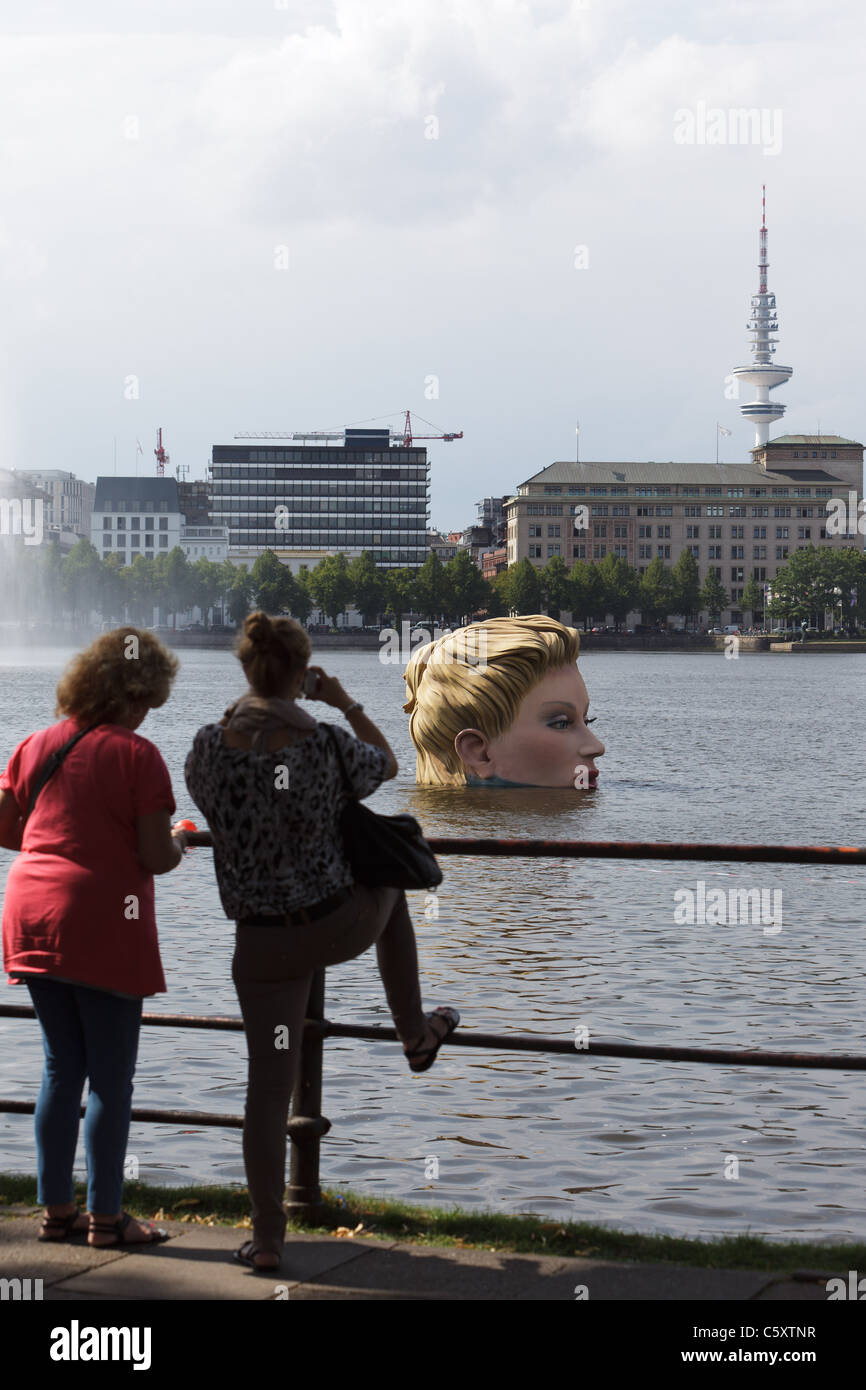 A 'mermaid' sculpture created by Oliver Voss is seen on Alster lake. Stock Photo