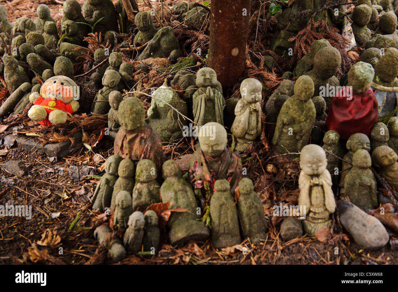 People bring jizo buddhist statues to the small shrine from all over