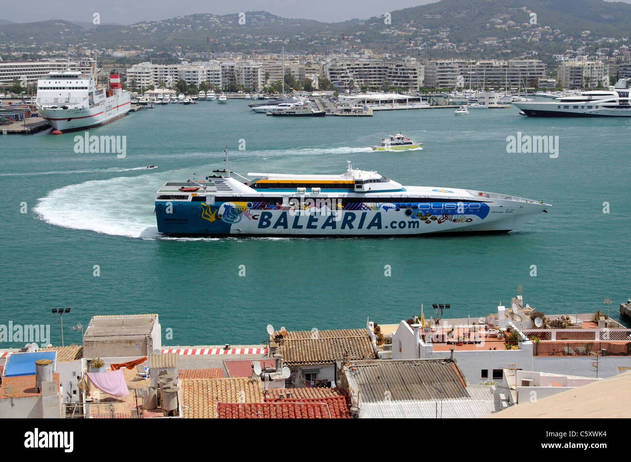 Roro fast ferry Ramon Llull of the Balearia company enters Eivissa port on the Spanish island of Ibiza Stock Photo