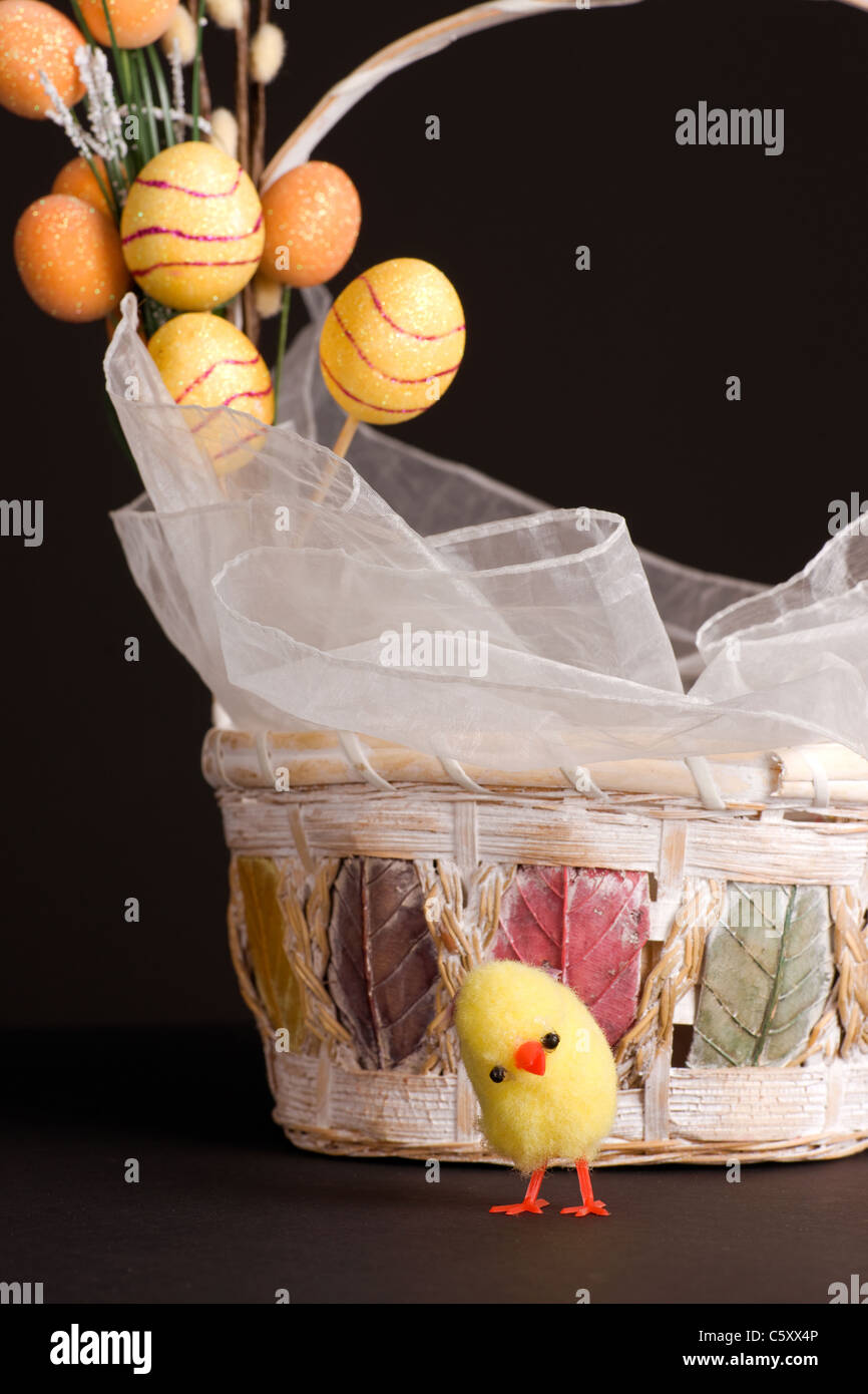 Easter backet and chicken with colored eggs Stock Photo