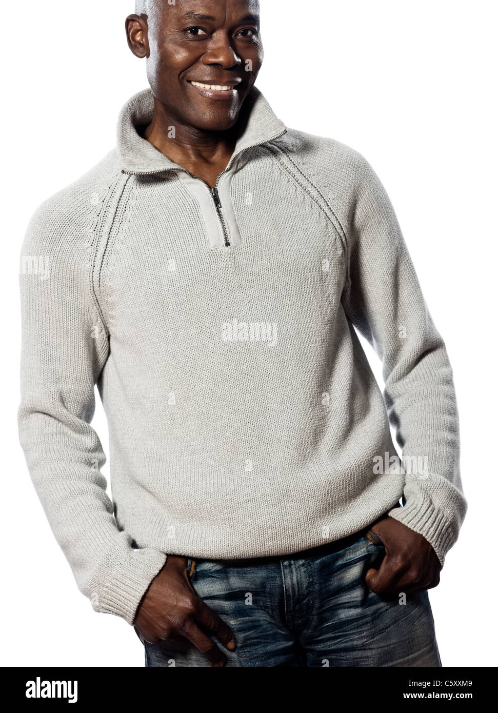 Casual mature afro American man standing smiling in studio with hands in pocket on isolated white background Stock Photo