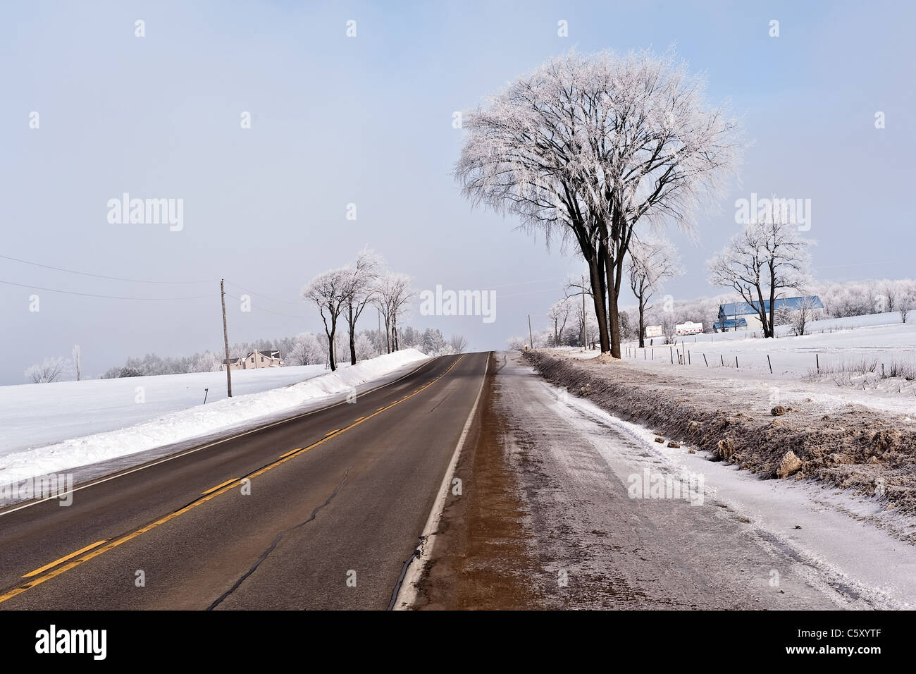 Rural road in Northern Ontario in winter Stock Photo