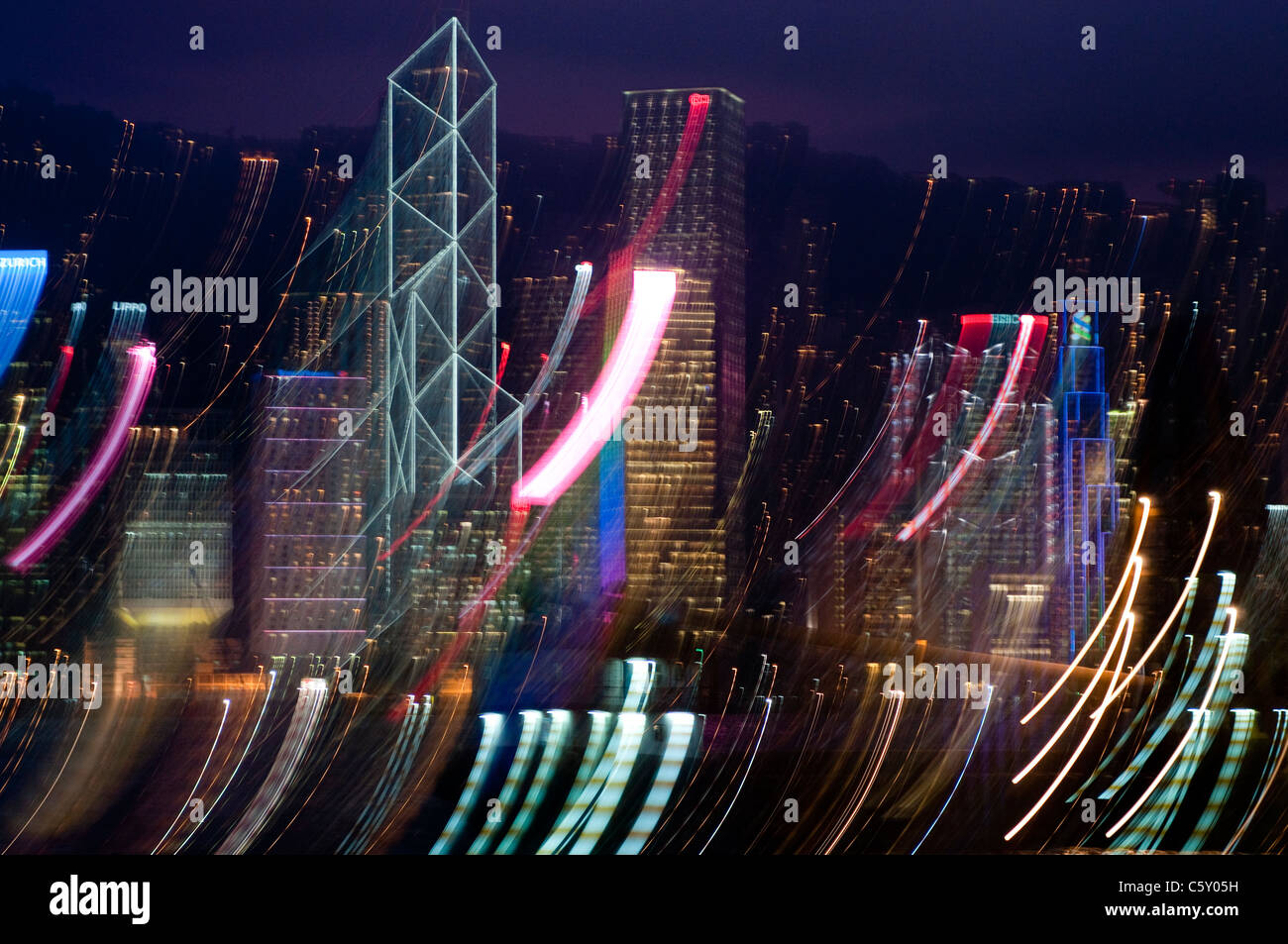 Hong Kong skyline at night with abstract blurred movement of lights Stock Photo