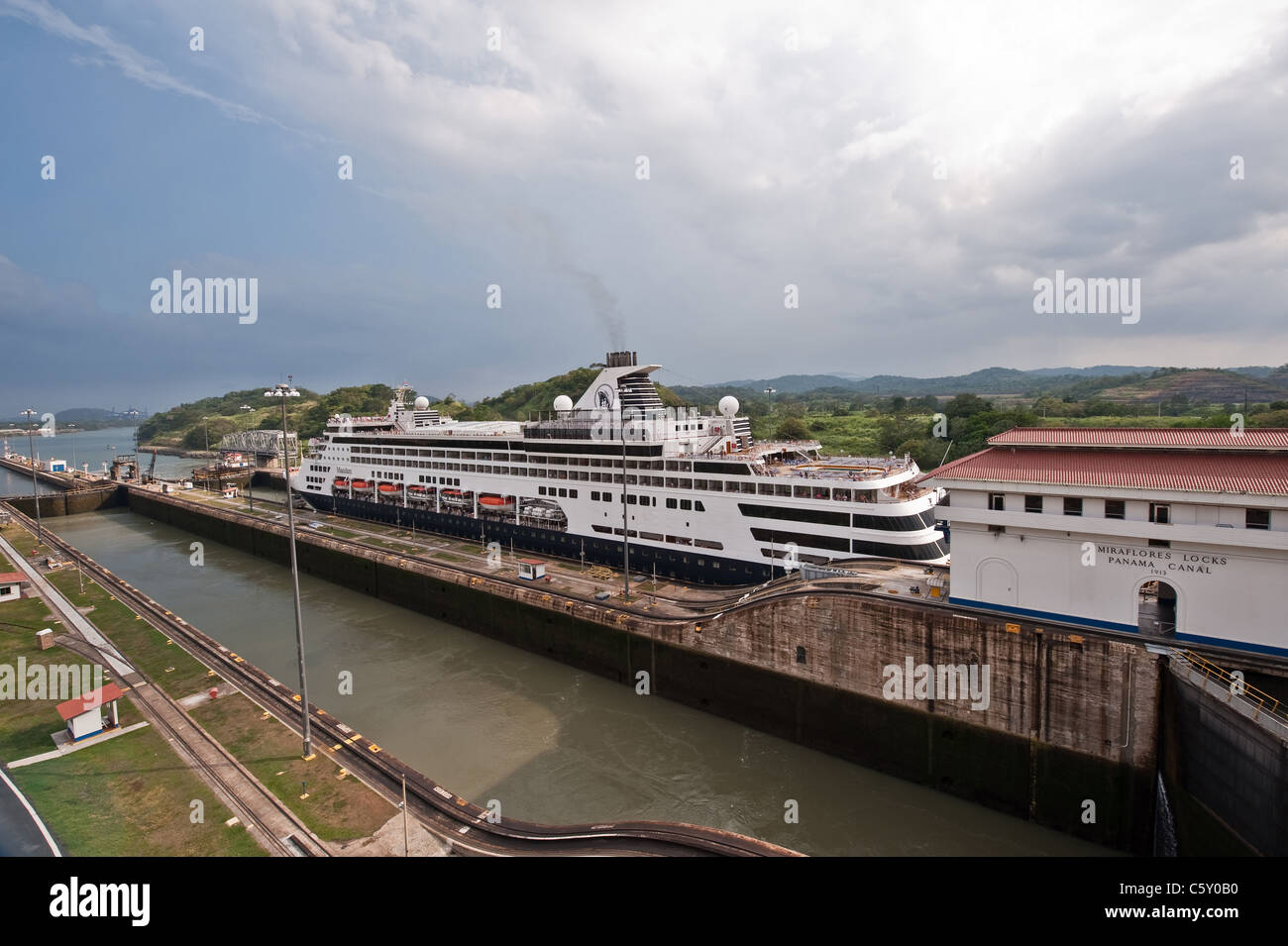 Ship is entering Miraflores locks in Panama Canal Stock Photo - Alamy