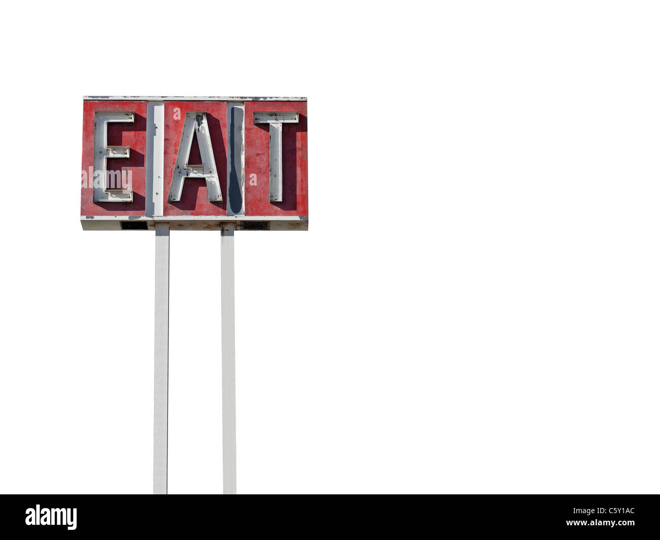 Tall eat sign ruin along a California desert highway. Stock Photo