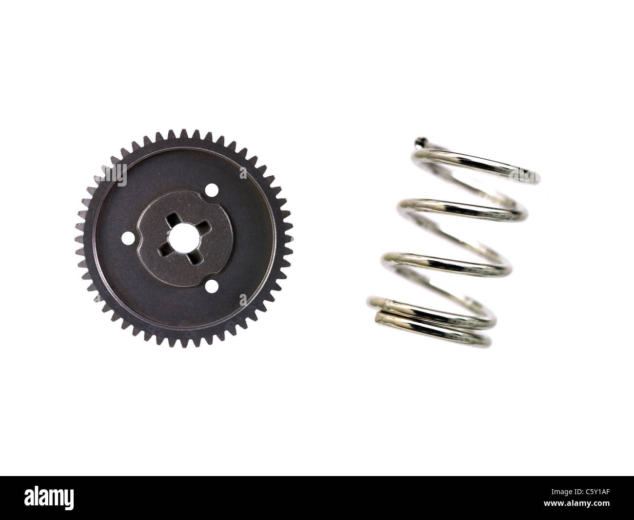A spring and cog isolated against a white background Stock Photo - Alamy