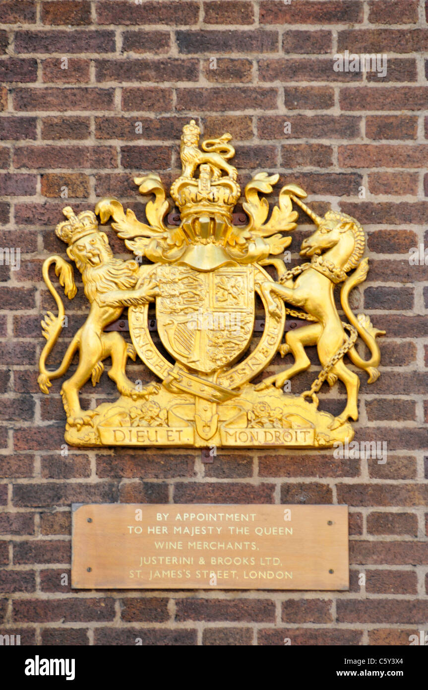 Royal Warrant & Royal coat of arms on premises of wine merchant Justerini & Brooks Ltd business owned by Diageo in St James's Street London England UK Stock Photo