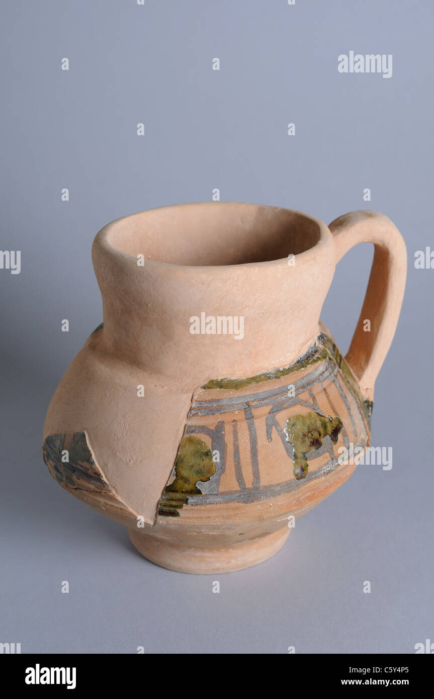 Ceramic jug with a handle and glaze decoration partial dry rope. Medieval period in  ' Burgo de Santiuste Museum'- SPAIN Stock Photo