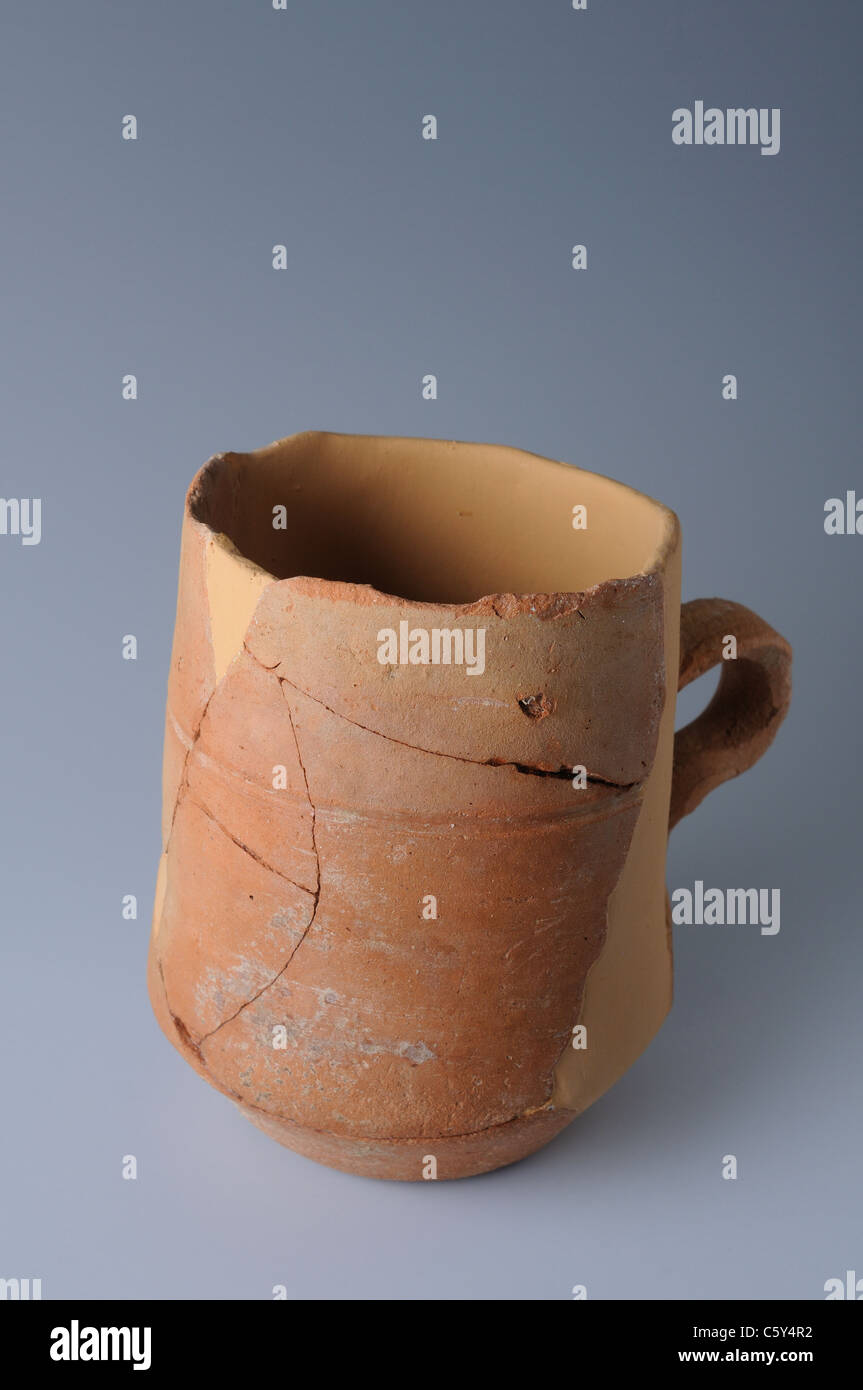 Bisque ceramic jar with a handle . Medieval period in  " Burgo de Santiuste Museum"- SPAIN Stock Photo