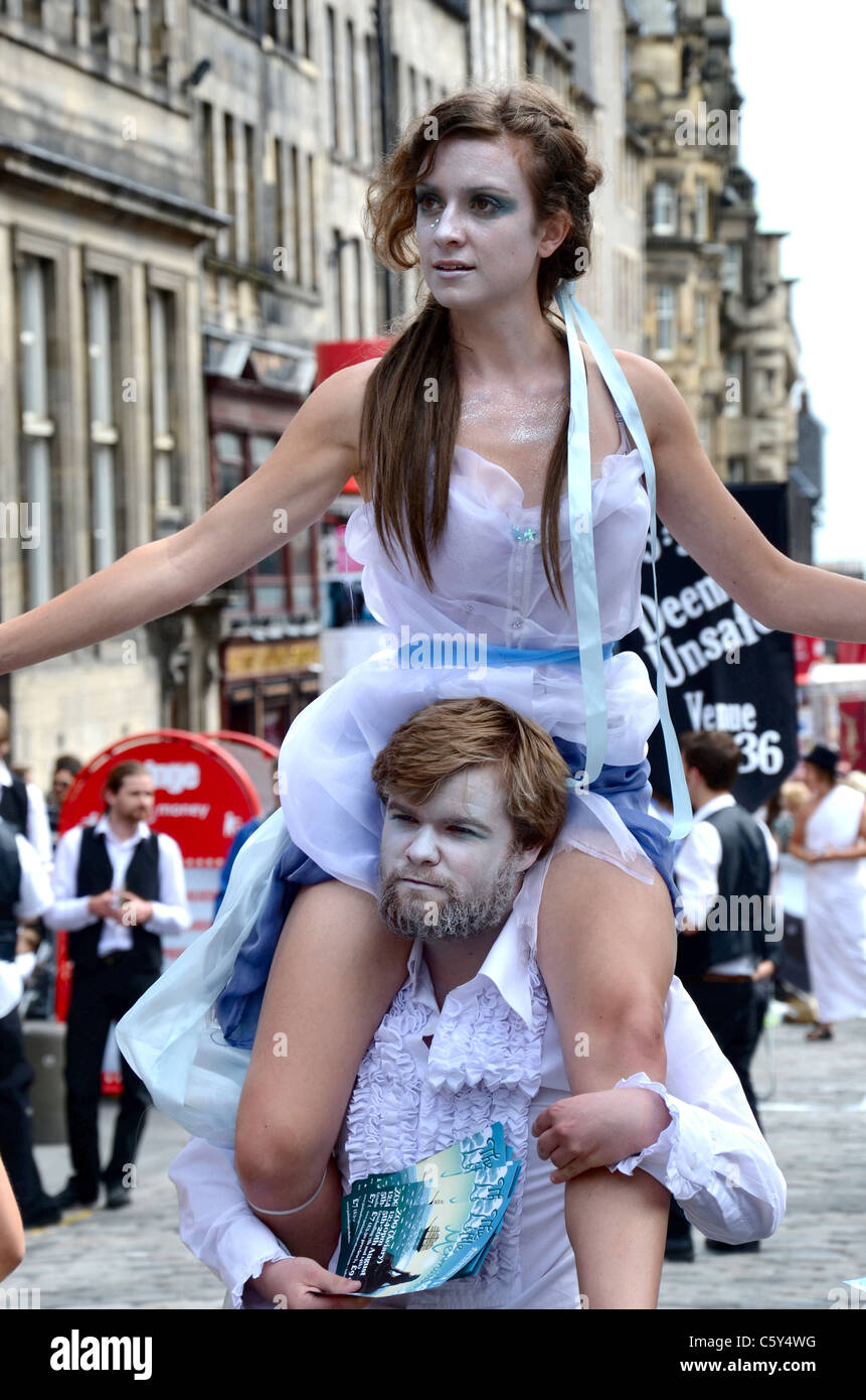 Cast members promote their Edinburgh Fringe play on the High Street. Stock Photo