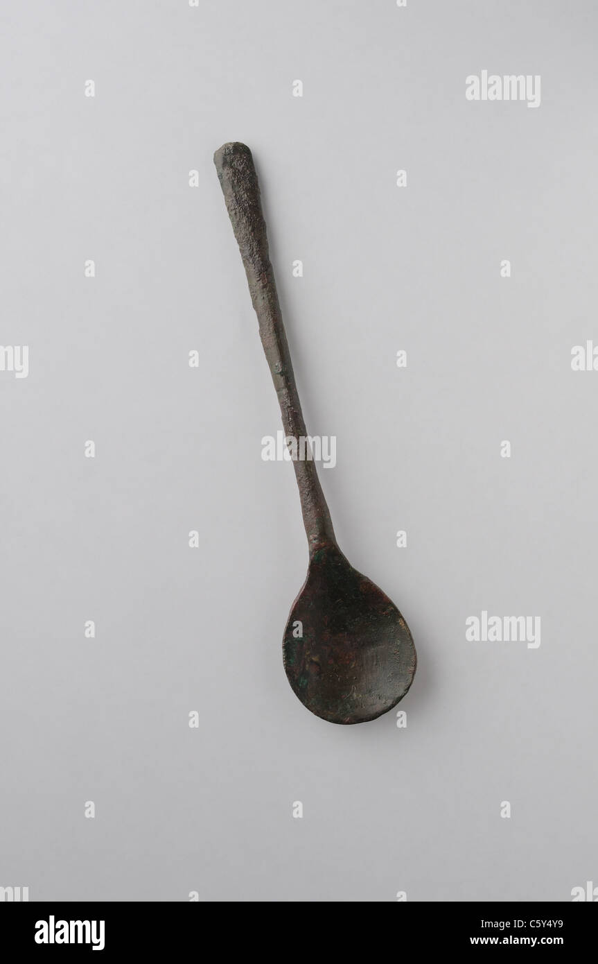 Spoon handle made of bronze . Medieval period in  " Burgo de Santiuste Museum"- SPAIN Stock Photo
