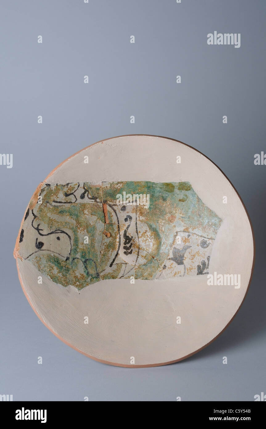 Glazed ceramic dish with floral decoration .  Medieval period in  ' Burgo de Santiuste Museum'- SPAIN Stock Photo