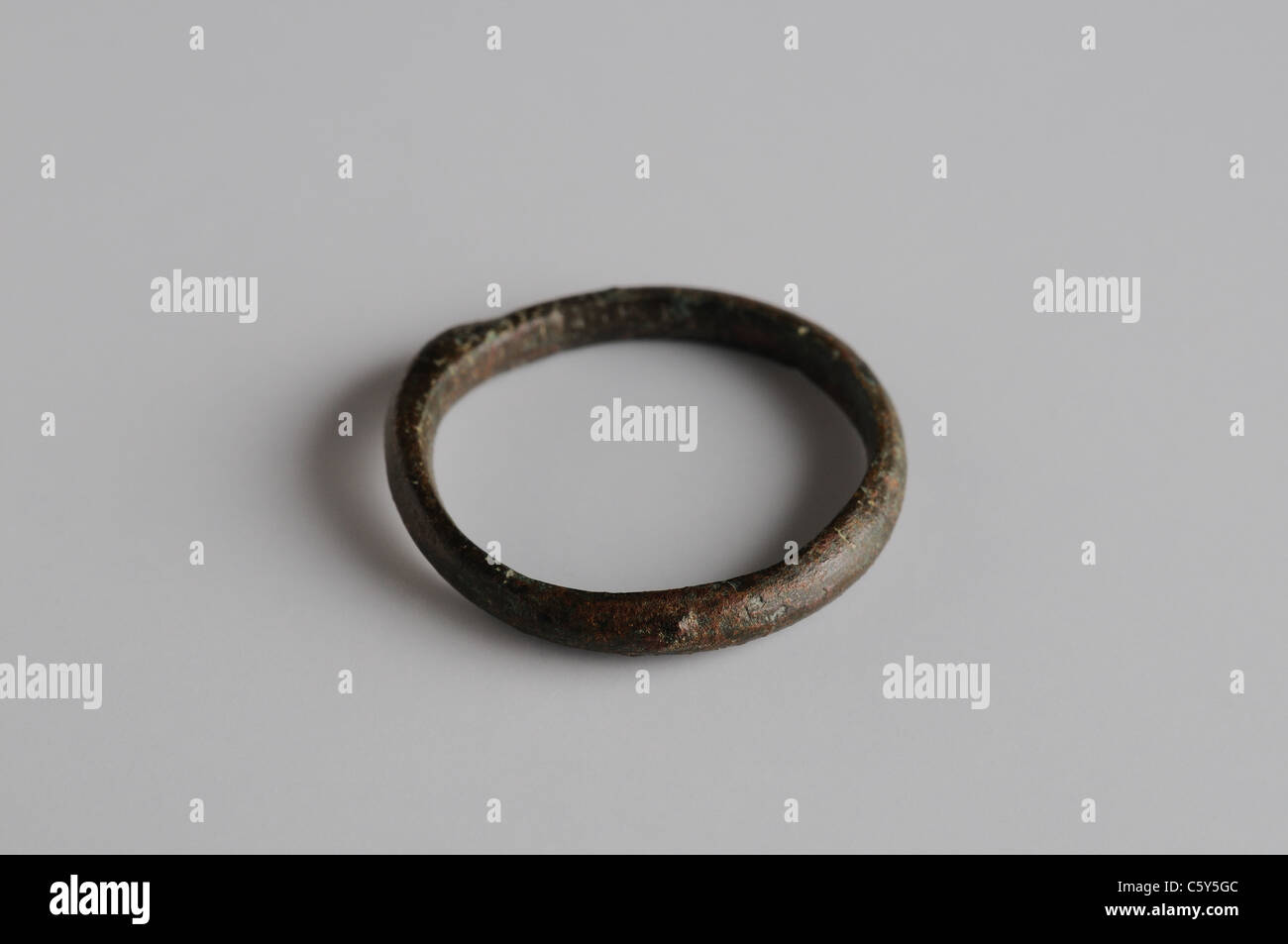 Bronze ring with rounded outer edge. 2.3 x 0.2 cm - Medieval period  in  " Burgo de Santiuste Museum"- SPAIN Stock Photo