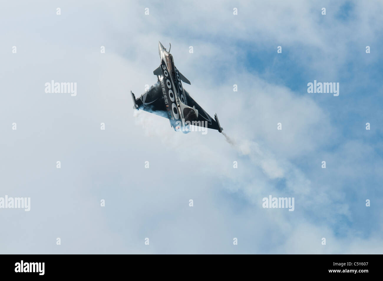 French Air Force military fighter jet Dassault Rafale C painted in its striking Trente Mille Heures scheme displays at the RIAT Stock Photo