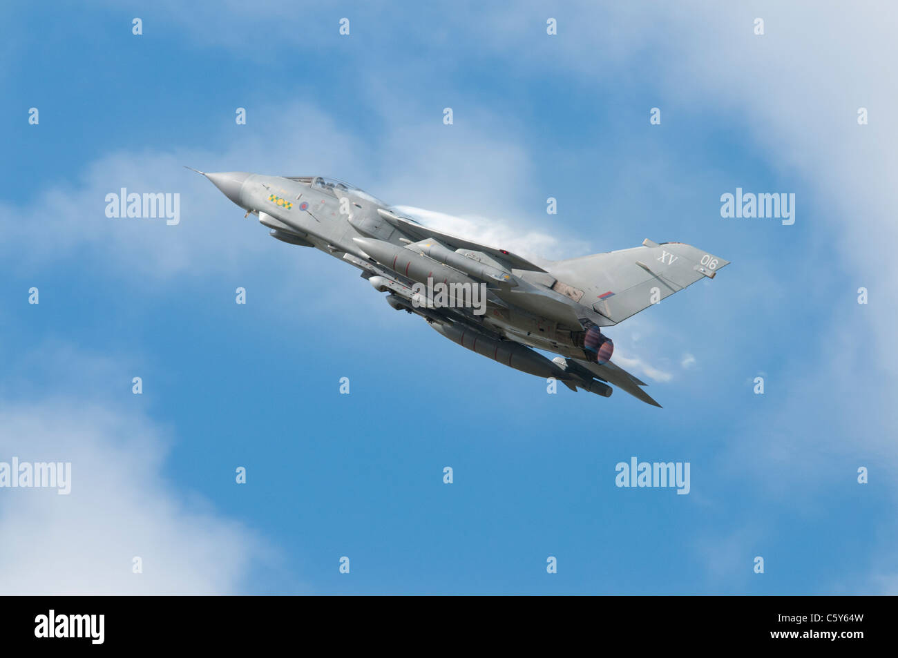 British Panavia Tornado GR4 Multi Role Combat Aircraft Desingation ZD410 from RAF Lossiemouth Scotland flies out of the cloud Stock Photo