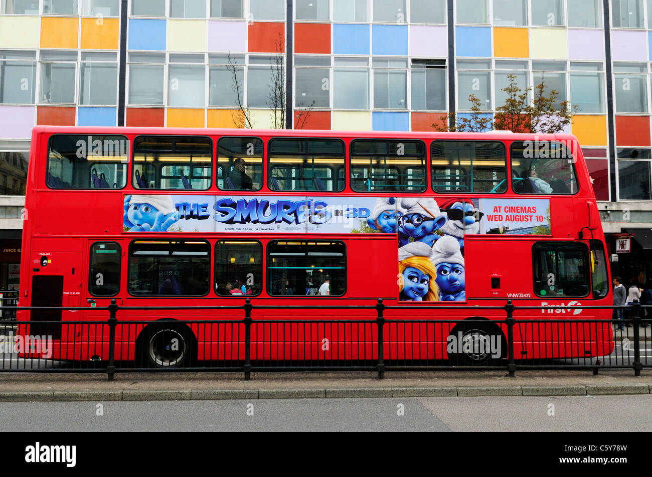 Double Decker Bus with The Smurfs Advert, Notting Hill Gate, London, England, UK Stock Photo