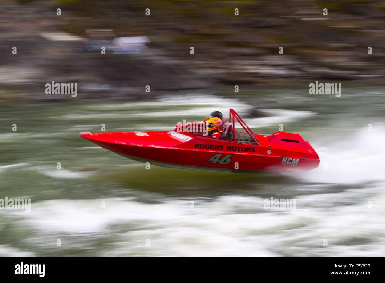 Ryan Rogers powers through Time Zone rapids in his red 46 boat during