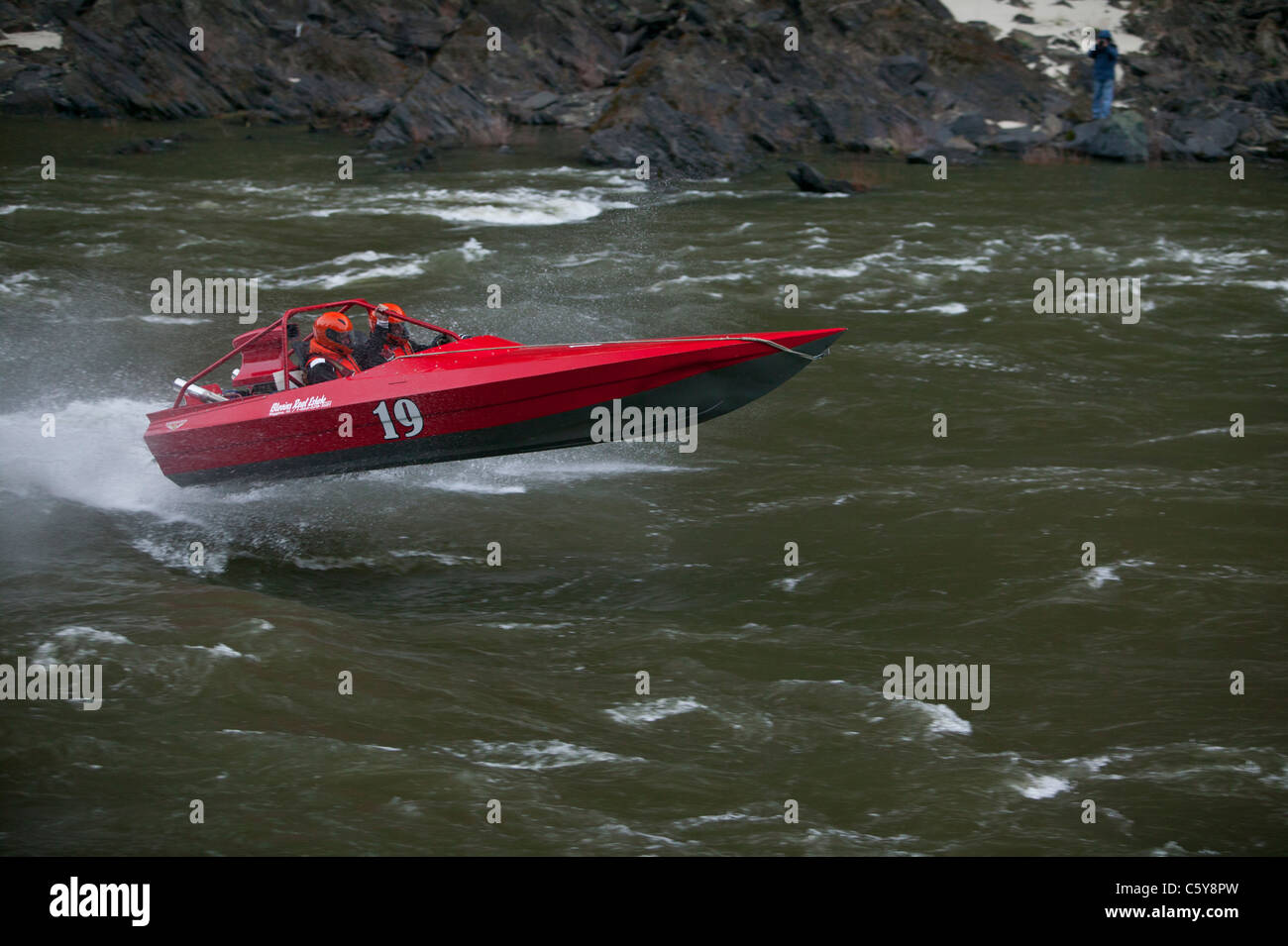 Mike Egbers powers through Time Zone rapids in his red 19 boat during